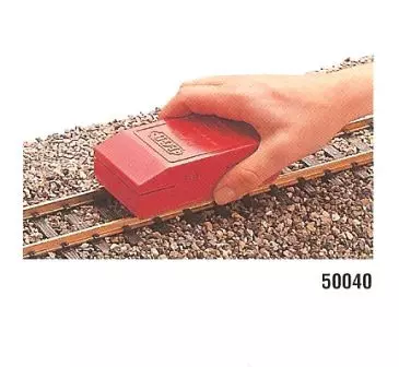 Blocco di pulizia per binari